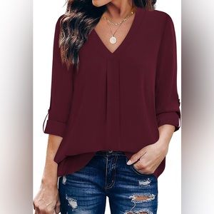 Lightweight long sleeve dark red blouse.